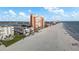 Panoramic aerial view of beachfront condos with direct beach access, offering stunning views and coastal charm at 17960 Gulf Blvd # 225, Redington Shores, FL 33708