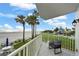 Outdoor balcony showing beach and surrounding landscape, with outdoor seating at 17960 Gulf Blvd # 225, Redington Shores, FL 33708