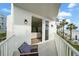 View from the balcony to the living area and beach with patio seating at 17960 Gulf Blvd # 225, Redington Shores, FL 33708