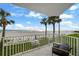 Balcony view showcasing the pristine beach and inviting outdoor seating at 17960 Gulf Blvd # 225, Redington Shores, FL 33708