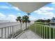 Relaxing balcony view overlooking the beach, providing a perfect spot to unwind and enjoy ocean breezes at 17960 Gulf Blvd # 225, Redington Shores, FL 33708