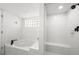 All white bathroom with a soaking tub and walk in shower at 17960 Gulf Blvd # 225, Redington Shores, FL 33708