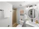 Bathroom showcases a white vanity, shower, and toilet for a functional space at 17960 Gulf Blvd # 225, Redington Shores, FL 33708