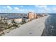 Aerial view of a beautiful beach with resorts, condominiums, and the intercoastal waterway at 17960 Gulf Blvd # 225, Redington Shores, FL 33708