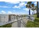 Inviting beach access with seating area, providing a seamless transition from the property to the sandy shores at 17960 Gulf Blvd # 225, Redington Shores, FL 33708