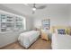 This bedroom is complete with tile floors and a large window overlooking the exterior at 17960 Gulf Blvd # 225, Redington Shores, FL 33708