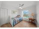 This bedroom is complete with tile floors and a large window overlooking the exterior at 17960 Gulf Blvd # 225, Redington Shores, FL 33708