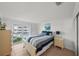 This bedroom is complete with tile floors and a large sliding glass door to the exterior at 17960 Gulf Blvd # 225, Redington Shores, FL 33708