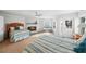 Bright bedroom with two beds, fireplace, and beach view from a private balcony at 17960 Gulf Blvd # 225, Redington Shores, FL 33708