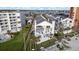 Aerial view of condos with beach access, lush landscaping, and scenic surroundings at 17960 Gulf Blvd # 225, Redington Shores, FL 33708