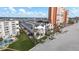 Aerial view of beachside condos with white exteriors, palm trees, and manicured landscaping at 17960 Gulf Blvd # 225, Redington Shores, FL 33708