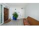 Hallway with tile flooring and a woven couch, with decor and unit numbers 224 and 225 at 17960 Gulf Blvd # 225, Redington Shores, FL 33708