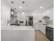 Modern kitchen featuring white cabinets, stainless steel appliances, and quartz countertops at 17960 Gulf Blvd # 225, Redington Shores, FL 33708