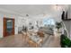 Bright living room featuring tile floors, comfortable seating, and stunning views at 17960 Gulf Blvd # 225, Redington Shores, FL 33708