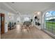 Bright, spacious living room with fireplace, tile floors, and scenic ocean views at 17960 Gulf Blvd # 225, Redington Shores, FL 33708