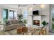 Bright living room featuring a white brick fireplace, comfortable seating, and ocean views at 17960 Gulf Blvd # 225, Redington Shores, FL 33708