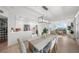 Bright and modern open space with spiral staircase, kitchen, dining and living areas at 17960 Gulf Blvd # 225, Redington Shores, FL 33708