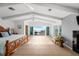 Light-filled main bedroom featuring high ceilings, balcony access with ocean views, and comfortable furnishings at 17960 Gulf Blvd # 225, Redington Shores, FL 33708