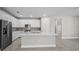 Well-equipped kitchen features a large island, stainless steel appliances, and ample storage space at 1925 Pepper Grass Dr, North Port, FL 34289
