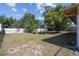 Spacious backyard with mature trees and ample room for outdoor activities at 2071 Linwood Ave, Spring Hill, FL 34608