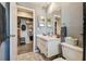 Bathroom with vanity, mirror, modern fixtures, tile floors, and plenty of storage at 2071 Linwood Ave, Spring Hill, FL 34608