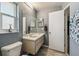 Bathroom featuring wood look flooring, vanity with mirror, toilet, and window at 2071 Linwood Ave, Spring Hill, FL 34608