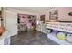 Bright, pink bedroom featuring a bunk bed, tiled floor, and closet with lots of storage at 2071 Linwood Ave, Spring Hill, FL 34608