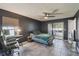 Bedroom featuring a ceiling fan, work space, and sliding glass doors to the outside at 2071 Linwood Ave, Spring Hill, FL 34608