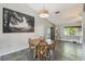 Cozy dining area features a round table, tile floors, and natural light at 2071 Linwood Ave, Spring Hill, FL 34608