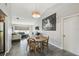 Dining room with tile floors, modern light fixture, and adjacent living spaces at 2071 Linwood Ave, Spring Hill, FL 34608
