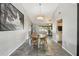 Bright dining room with modern light fixture and easy access to kitchen and living space at 2071 Linwood Ave, Spring Hill, FL 34608