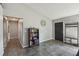 Inviting foyer features tile floors and a convenient coat rack with bench at 2071 Linwood Ave, Spring Hill, FL 34608