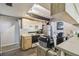 Kitchen with neutral cabinets, tile floor, and modern appliances, creating a cozy space at 2071 Linwood Ave, Spring Hill, FL 34608