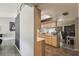 Well-lit kitchen features wood cabinets, modern appliances, and an adjacent workspace at 2071 Linwood Ave, Spring Hill, FL 34608