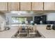 Kitchen pass-through offers view to living room/office area and natural light at 2071 Linwood Ave, Spring Hill, FL 34608