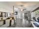 Spacious living room flows into dining area, featuring tile floors and natural light at 2071 Linwood Ave, Spring Hill, FL 34608