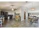 Open-concept living room with tile flooring, a fan, and dining area at 2071 Linwood Ave, Spring Hill, FL 34608