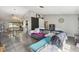 Open living area featuring tile floors, modern furnishings, and a bright, airy layout at 2071 Linwood Ave, Spring Hill, FL 34608
