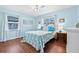 Serene blue bedroom with hardwood floors and bright windows at 2134 6Th N Ave, St Petersburg, FL 33713