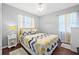 Charming bedroom with gray and yellow decor and ample natural light at 2134 6Th N Ave, St Petersburg, FL 33713