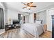 Cozy bedroom with wood-look flooring, ceiling fan, and closet storage at 2134 6Th N Ave, St Petersburg, FL 33713