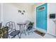 Inviting front porch with decorative chairs and a turquoise entry door at 2134 6Th N Ave, St Petersburg, FL 33713