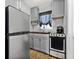Functional kitchen with gray cabinets, stainless steel appliances, and butcher block countertop at 2134 6Th N Ave, St Petersburg, FL 33713