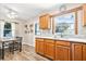 Kitchen and eat-in area feature wood floors and white countertops at 2134 6Th N Ave, St Petersburg, FL 33713