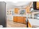 Traditional kitchen with wood cabinets, tiled backsplash, and stainless steel appliances at 2134 6Th N Ave, St Petersburg, FL 33713