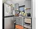 Efficient kitchen featuring gray cabinetry, stainless steel appliances, and a compact design at 2134 6Th N Ave, St Petersburg, FL 33713