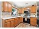 Well-lit kitchen featuring stainless steel appliances and wooden cabinets at 2134 6Th N Ave, St Petersburg, FL 33713