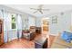 Bright living room featuring hardwood floors, neutral walls, and a ceiling fan at 2134 6Th N Ave, St Petersburg, FL 33713