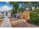 Beautifully landscaped yard with wood fencing and stone walkway leading to the home's entrance at 2134 6Th N Ave, St Petersburg, FL 33713