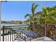 Balcony with decorative iron railings offering scenic views of the waterfront and surrounding landscape at 2233 Donato Dr, Belleair Beach, FL 33786